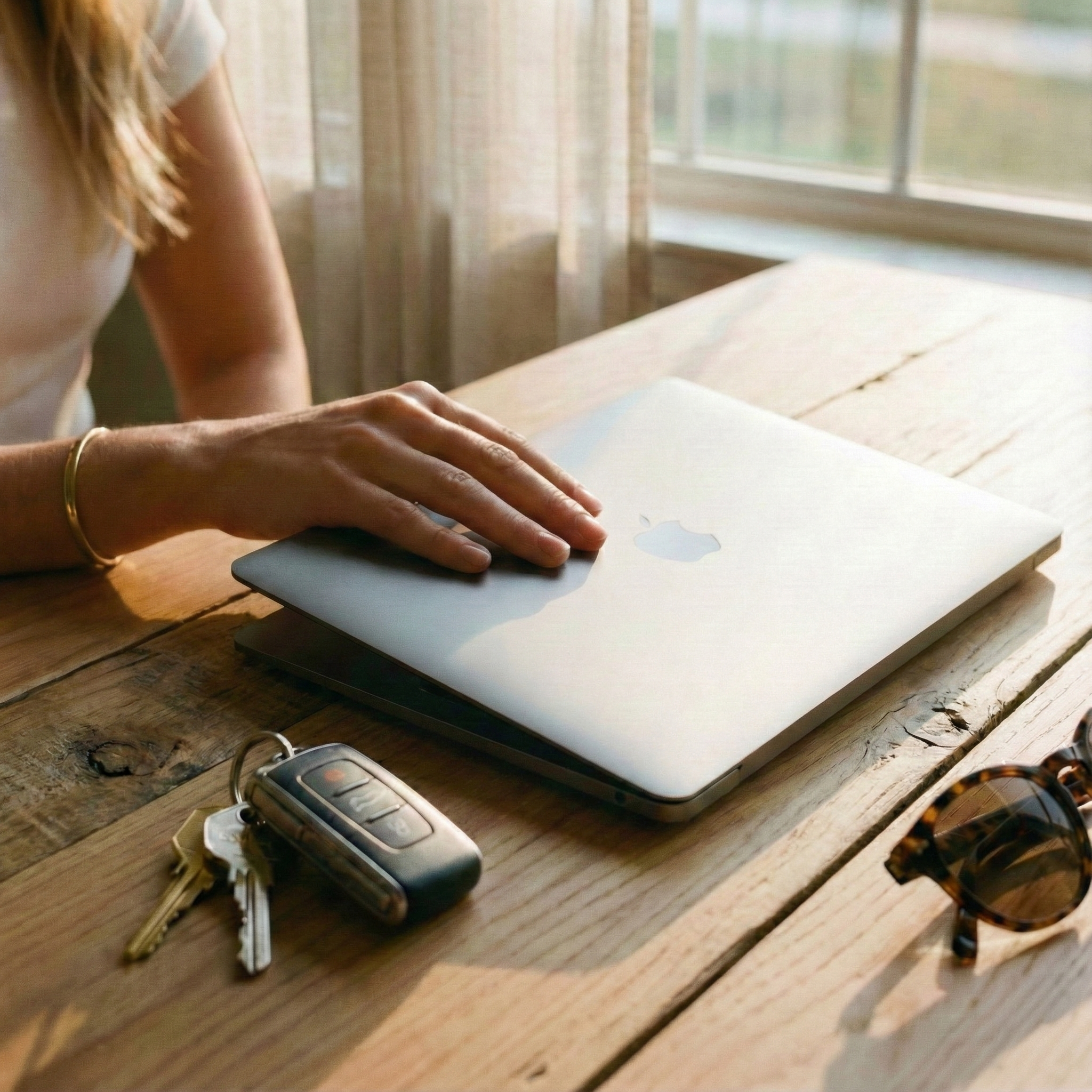 Finished work, laptop closed, keys ready